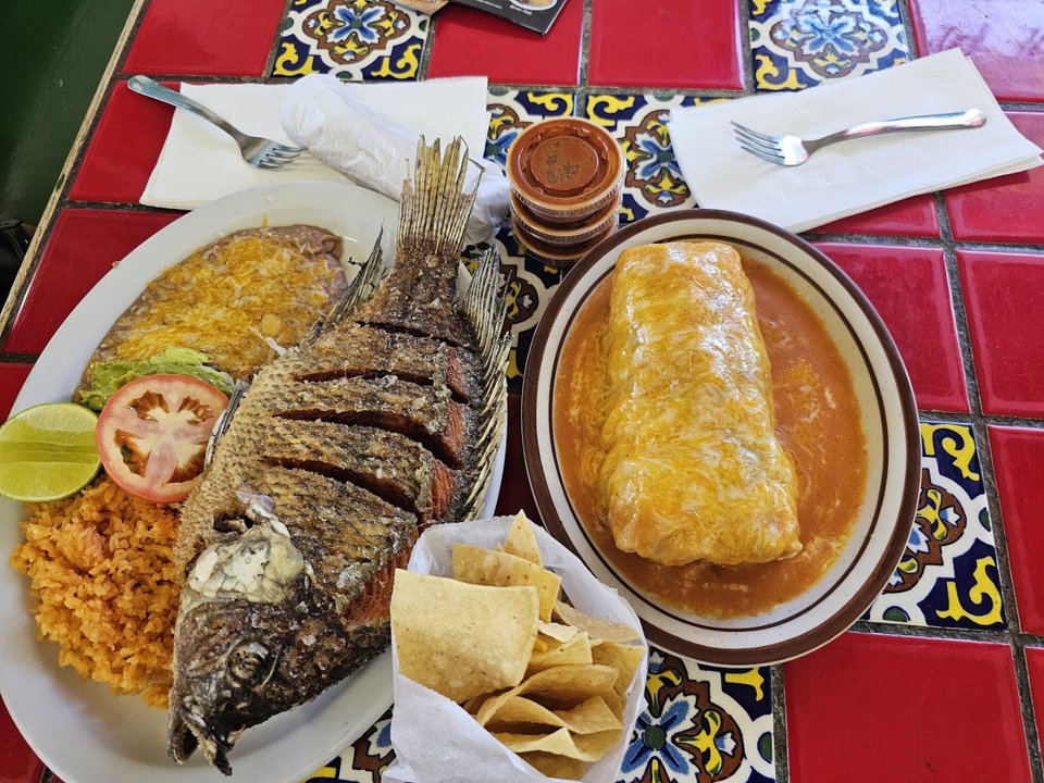 Colorful Mexican plates on a casual table.