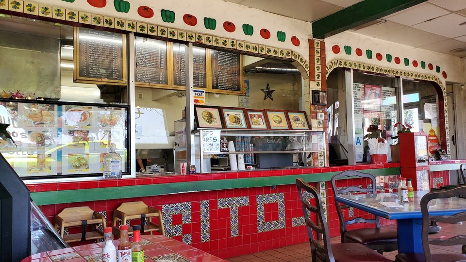 Counter service inside a cozy restaurant.